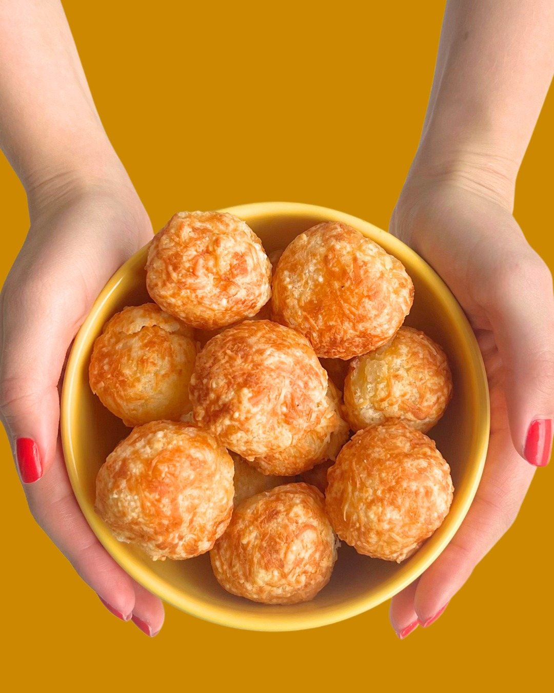 Bowl full of golden Queijoca crispy cheese puffs